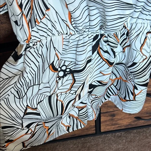 Adelyn Rae Black and Orange Patterned Romper - Picture 5 of 9